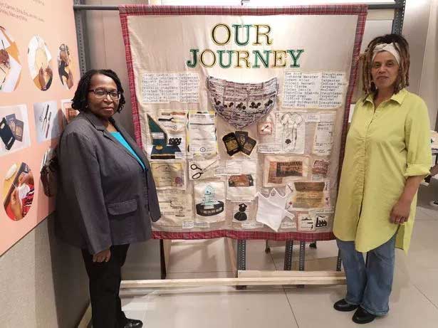 Dawn Denton and Millie Gobbin-Singh with Our Journey creation by Caribbean residents at Pannel Croft Retirement Village in Newtown